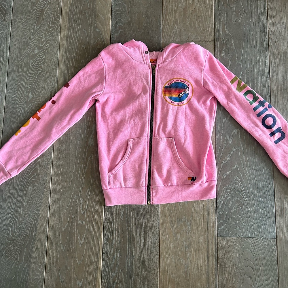 Aviator Nation pink zip-up hoodie.